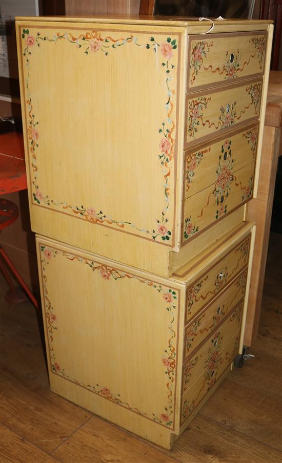 A pair of floral painted cream ground four drawer chests W.44cm